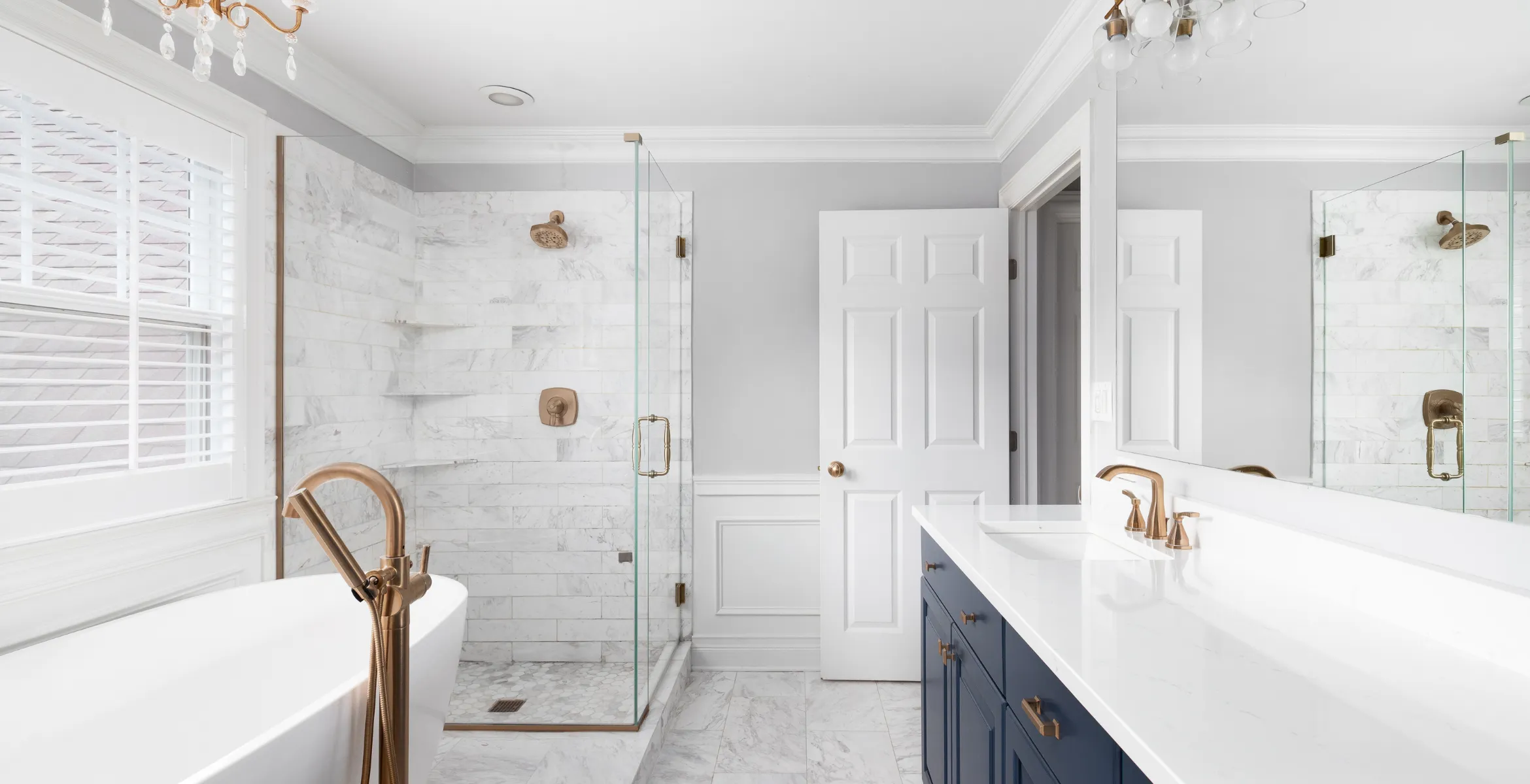 Modern bathroom addition in Dallas TX with glass-enclosed marble shower, double vanity with quartz countertop, and elegant custom finishes