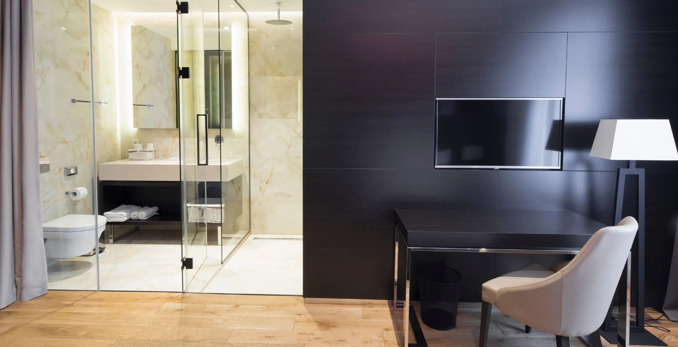 Luxury primary suite addition in Dallas TX with modern bathroom, glass shower, custom vanity, and integrated home office workspace